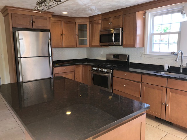 photograph of a tidy kitchen featuring a well-maintained countertop