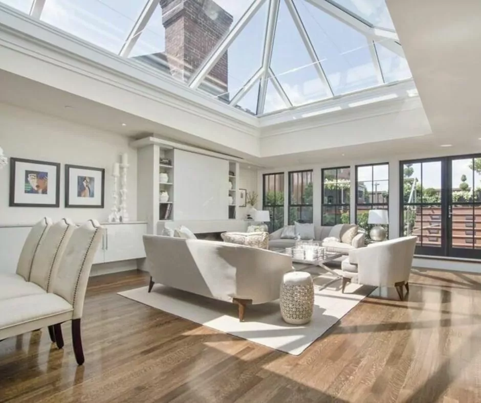 A spacious living room with a skylight.
